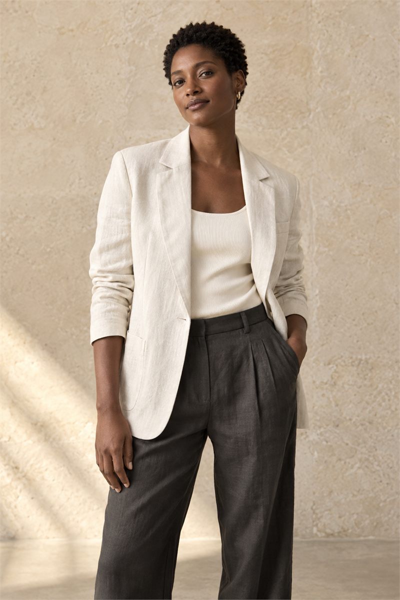 Model in an ivory linen blazer